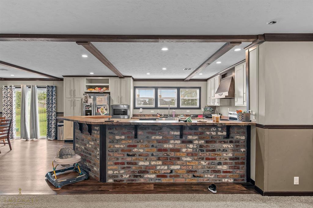 4638 Benton Road Bossier City, LA 71111 - Photo 10 of 34 a living room with fireplace furniture and a window
