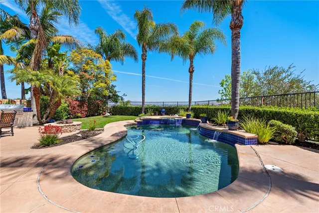 a view of a patio with couches chairs and wooden floor