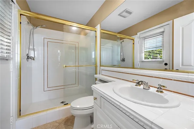 a utility room with sink dryer and washer