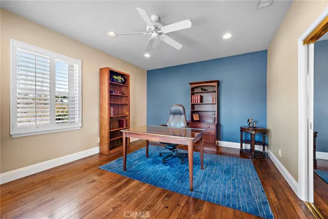 a bathroom with a double vanity sink mirror and a bathtub