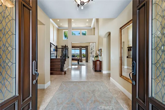 a room with pool table and a rug