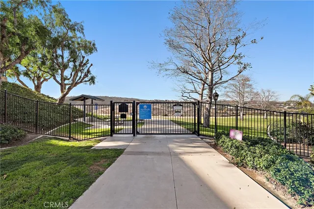 a view of swimming pool with outdoor seating and plants
