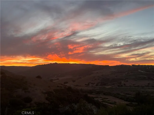 a view of a terrace with a table and chairs