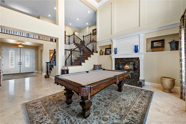 a room with pool table and furniture