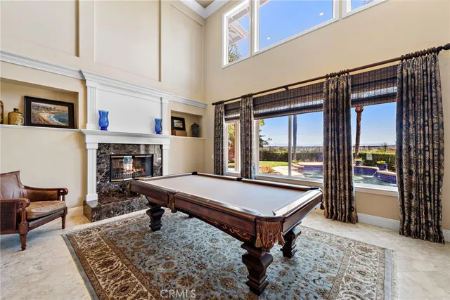 a view of a dining room with furniture and a chandelier