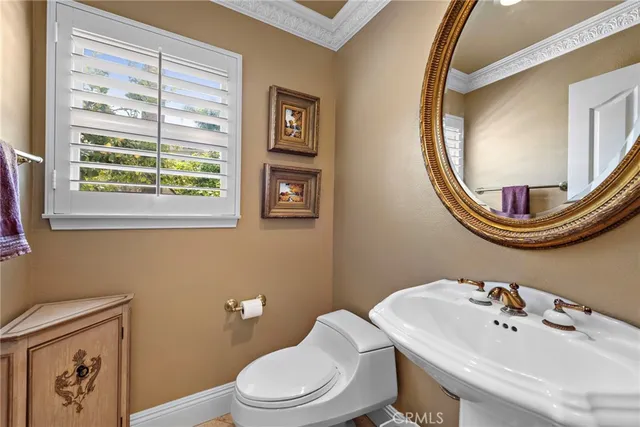 a kitchen with stainless steel appliances granite countertop a kitchen island a stove a table and chairs in it