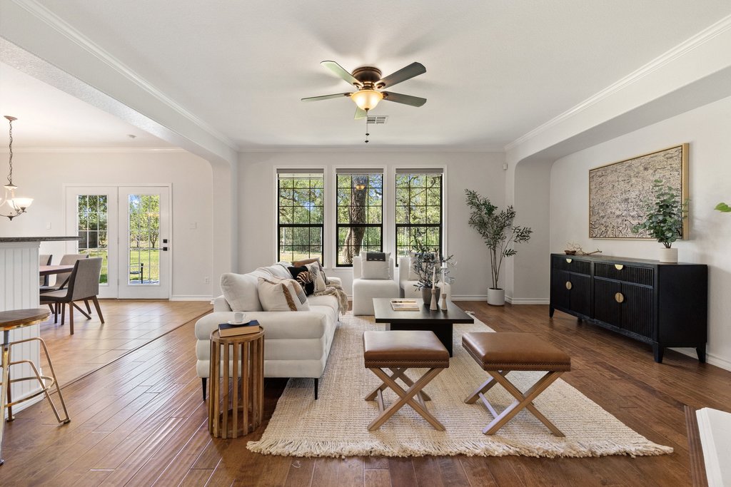 11129 Bastogne Loop Austin, TX 78739 - Photo 5 of 40 Wood flooring brings warmth and richness throughout the home. The natural textures and soft light make every space feel comfortable and inviting.