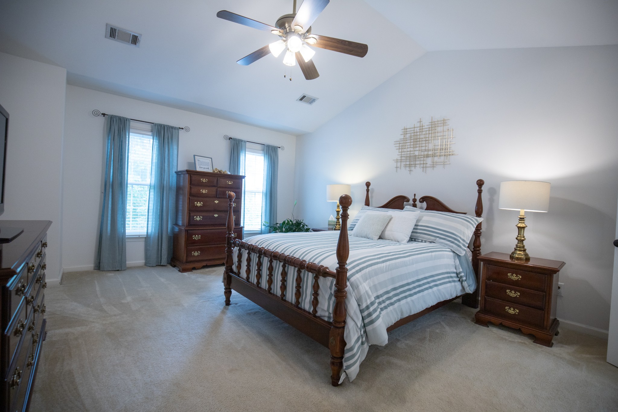 113 Chester Stevens Road Franklin, TN 37067 - Photo 16 of 31 a spacious bedroom with a bed and a chandelier