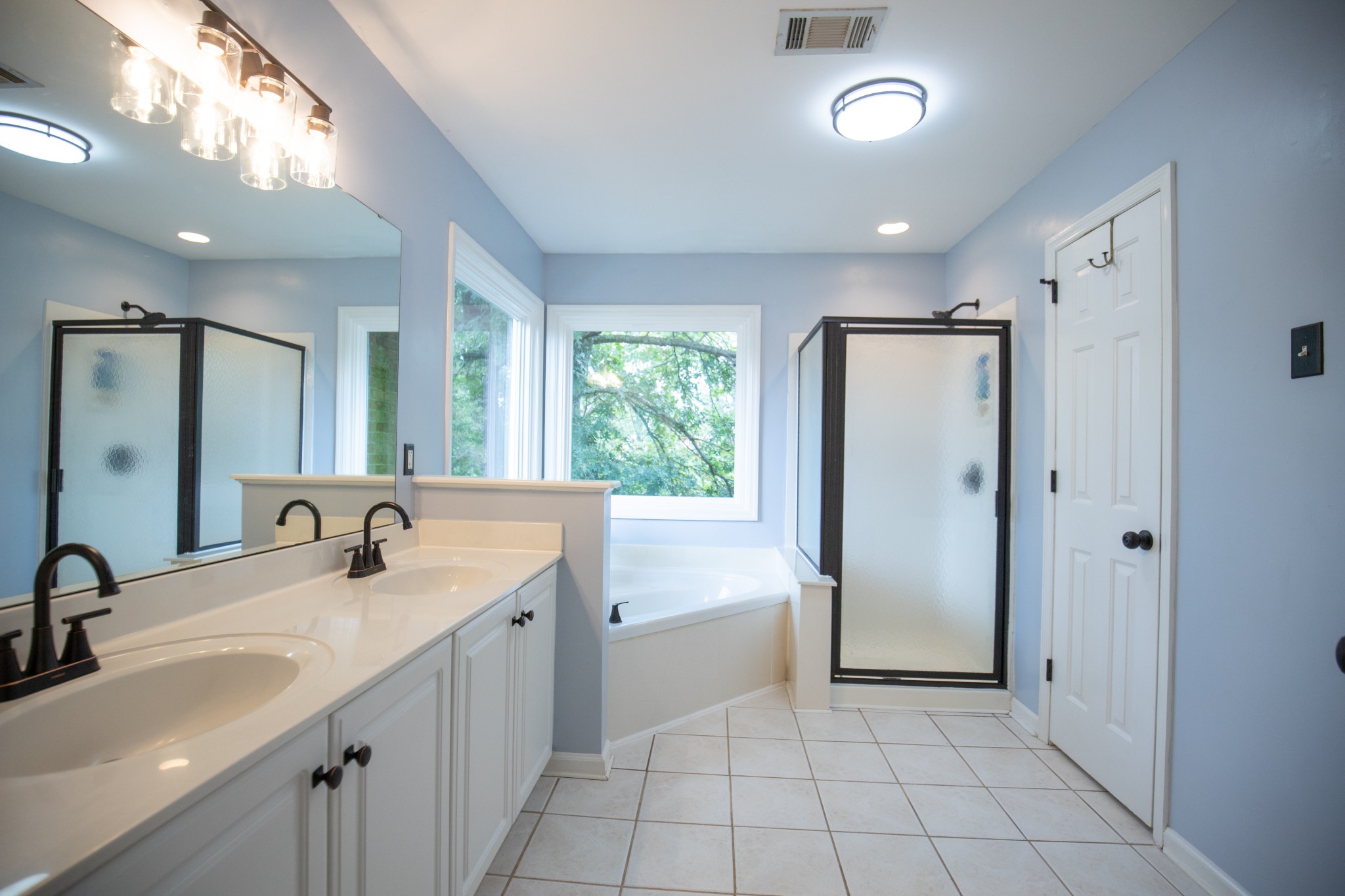 113 Chester Stevens Road Franklin, TN 37067 - Photo 17 of 31 a bathroom with a double vanity sink a mirror and a shower