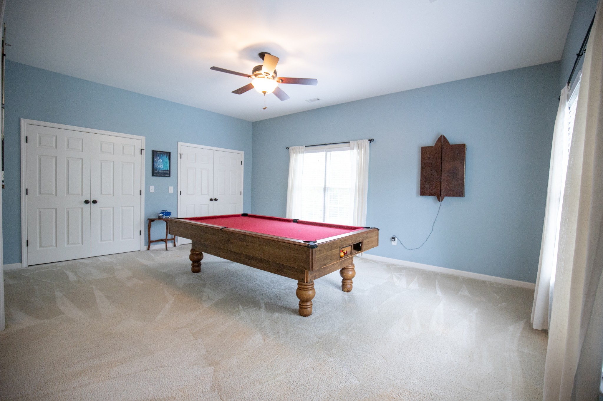 113 Chester Stevens Road Franklin, TN 37067 - Photo 25 of 31 a bedroom with a bed and a chandelier
