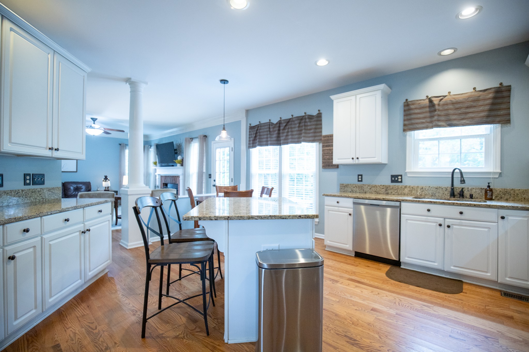 113 Chester Stevens Road Franklin, TN 37067 - Photo 10 of 31 a kitchen with granite countertop white cabinets a sink a window and appliances