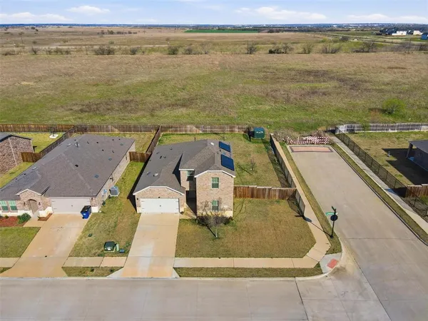an aerial view of a house with a ocean view