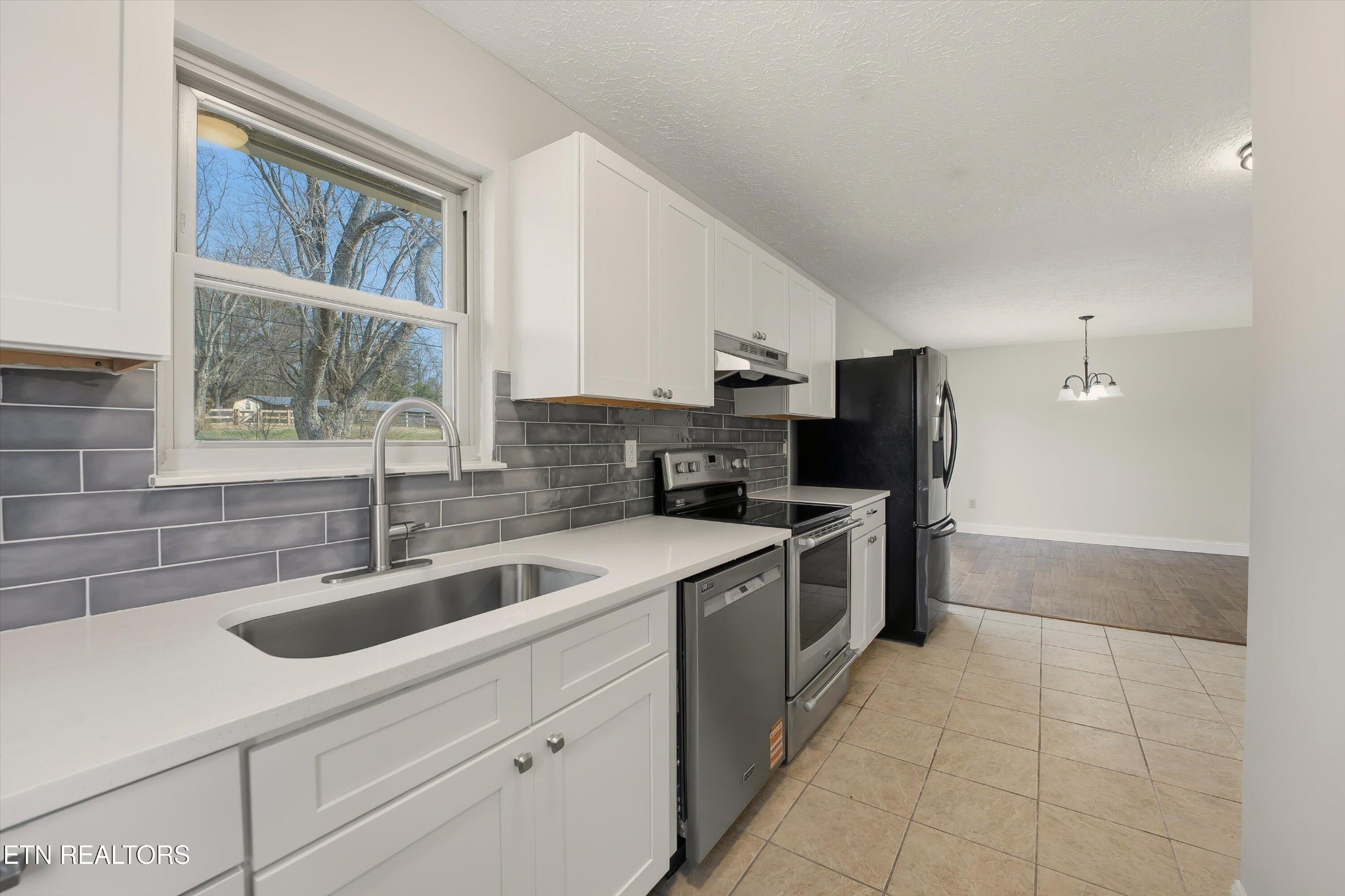 5413 Pryor Road Maryville, TN 37804 - Photo 17 of 33 a kitchen with a sink cabinets and stainless steel appliances