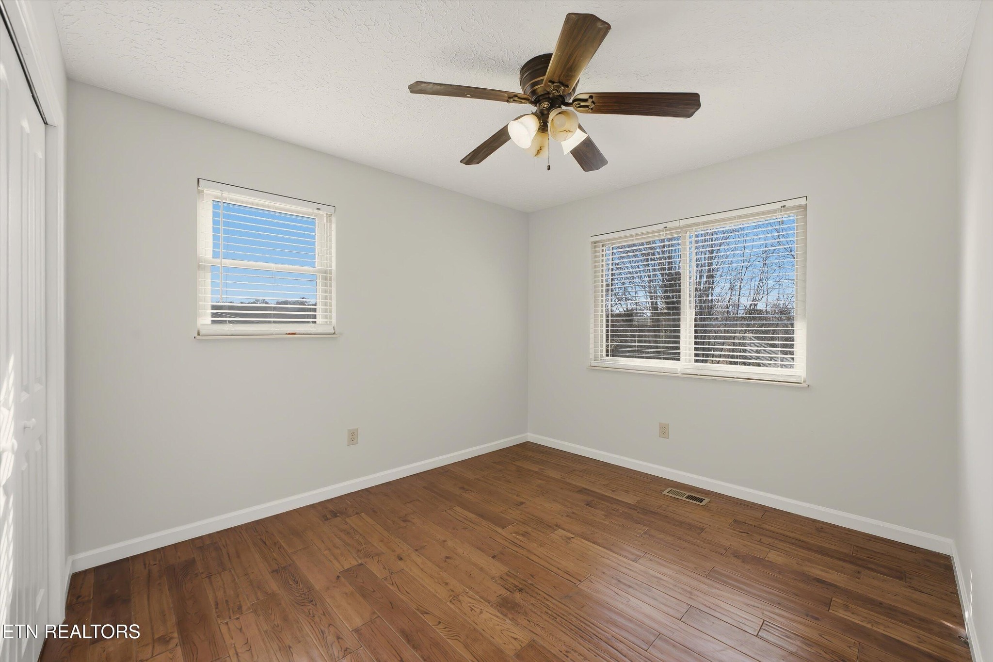 5413 Pryor Road Maryville, TN 37804 - Photo 22 of 33 a view of a big room with wooden floor and windows