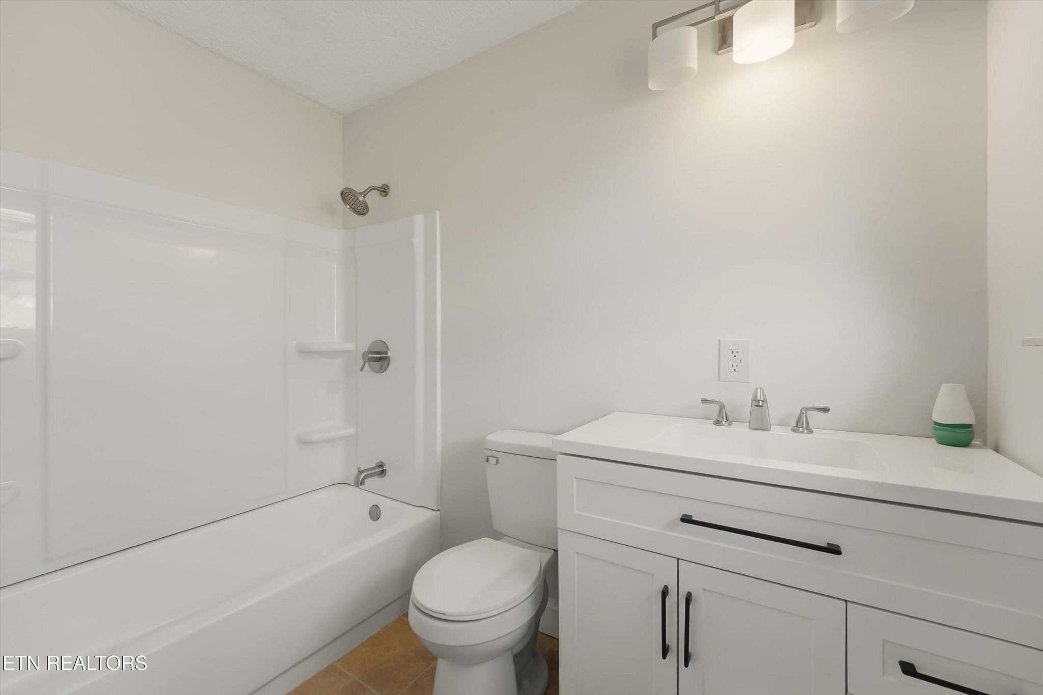 5413 Pryor Road Maryville, TN 37804 - Photo 25 of 33 a bathroom with a sink toilet vanity and tub