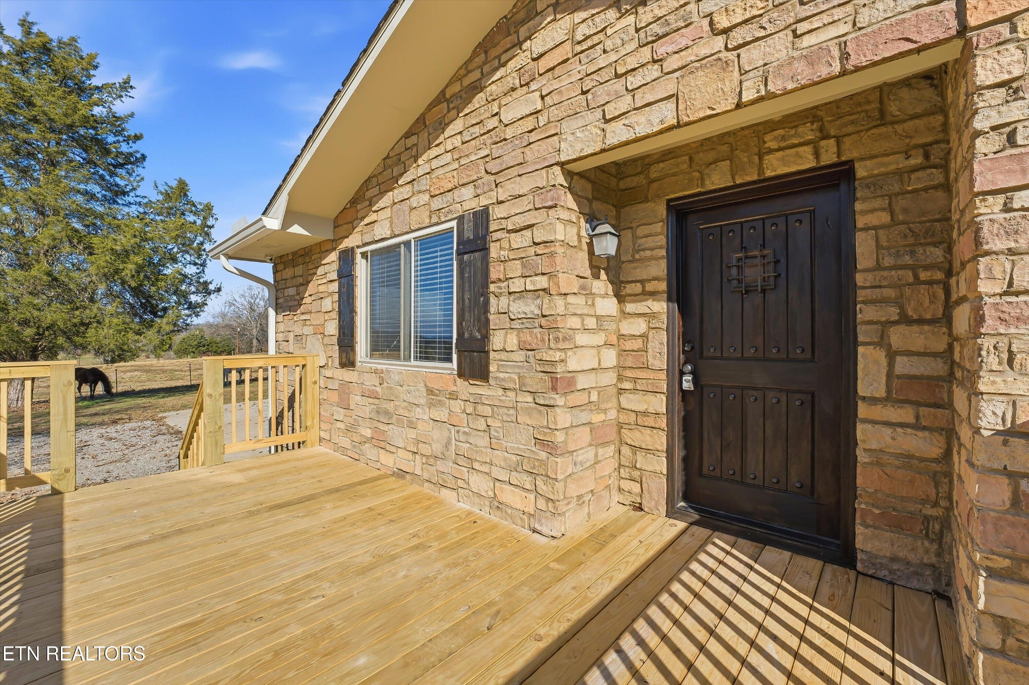 5413 Pryor Road Maryville, TN 37804 - Photo 6 of 33 a view of a balcony with door and wooden floor