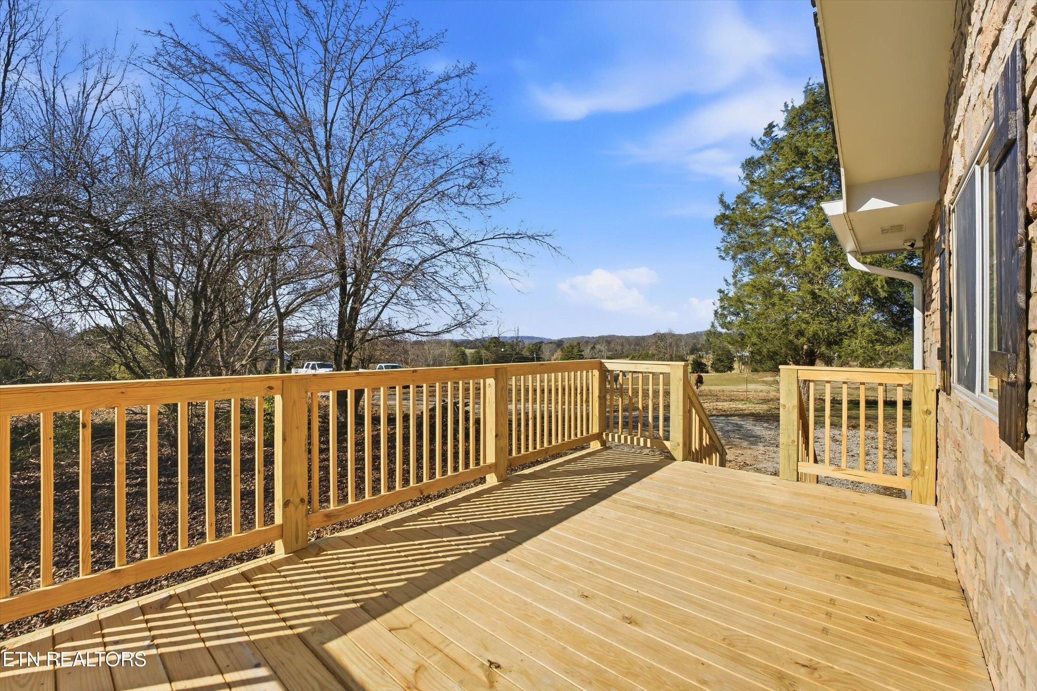 5413 Pryor Road Maryville, TN 37804 - Photo 7 of 33 a balcony with wooden floor and fence