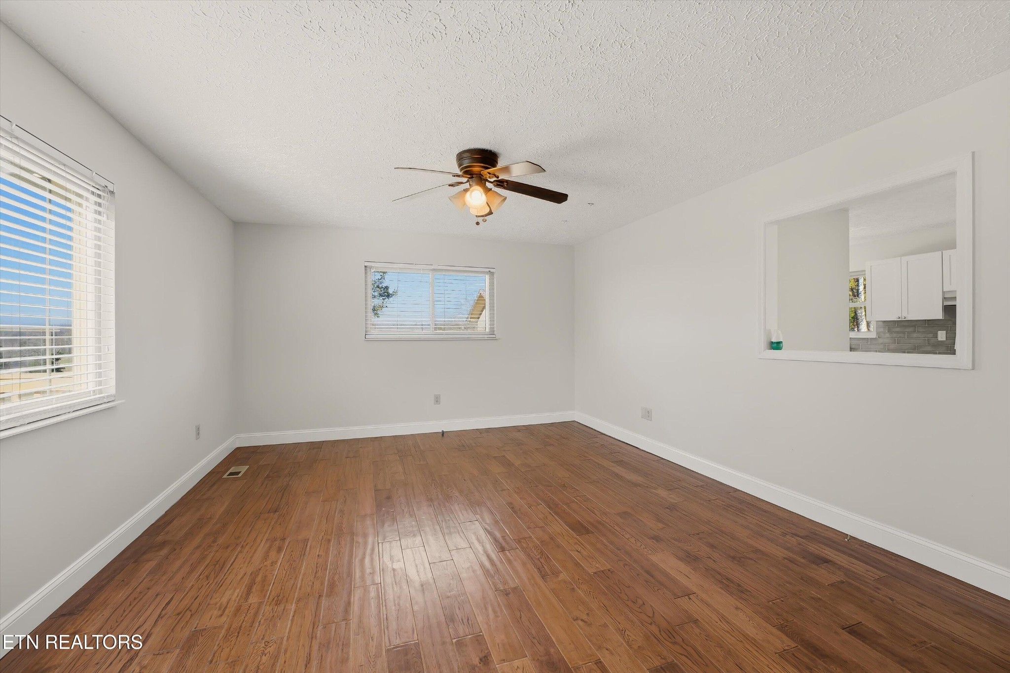 5413 Pryor Road Maryville, TN 37804 - Photo 8 of 33 wooden floor in an empty room with a window
