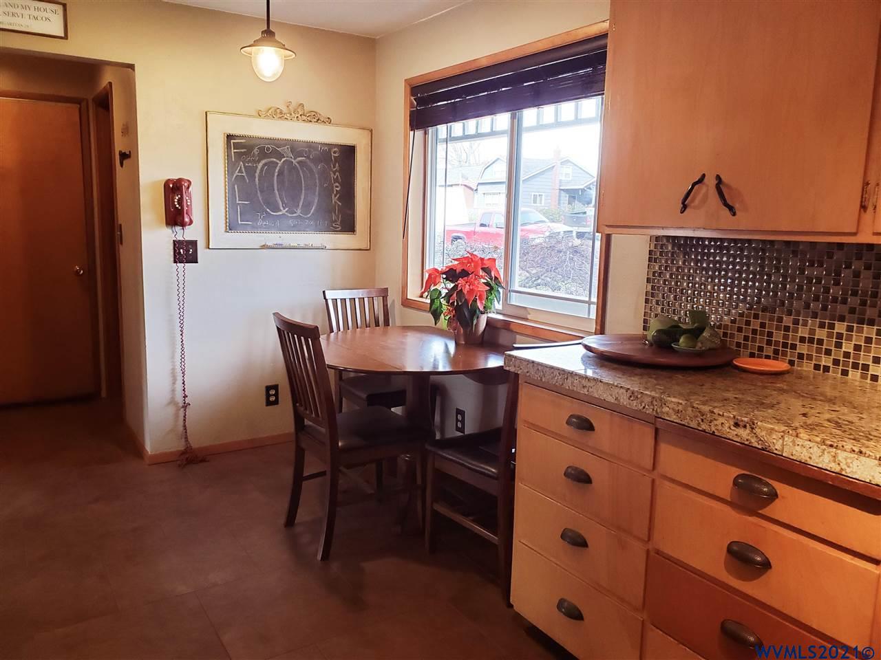 231 Northwest Reed Lane Dallas, OR 97338 - Photo 11 of 41 a view of a dining room with furniture window and outside view