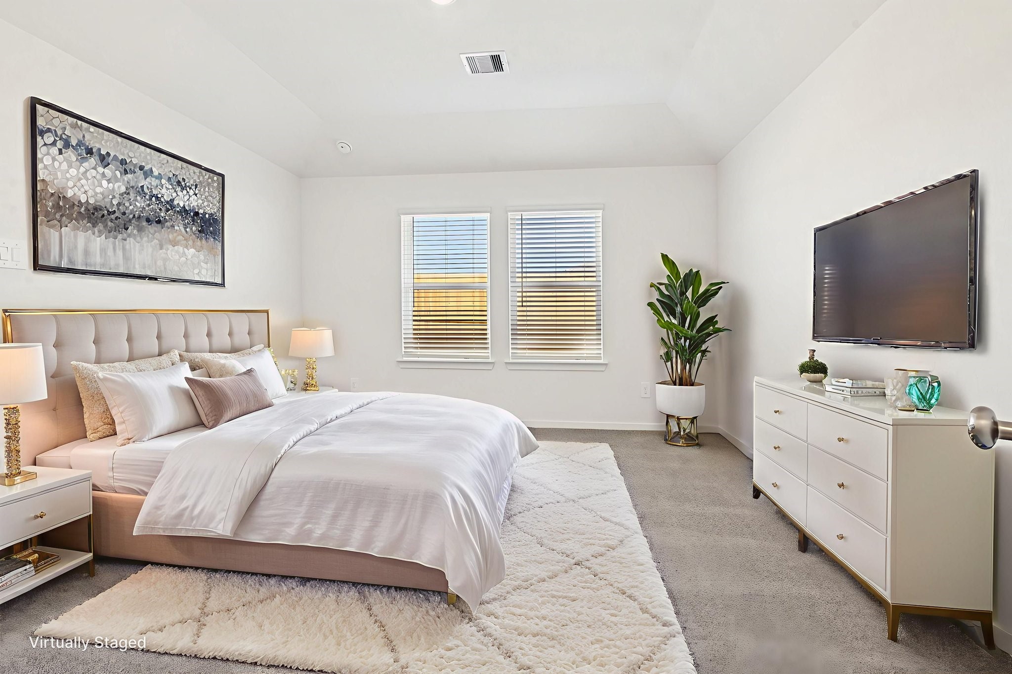 14147 Granger Pointe Lane Conroe, TX 77302 - Photo 16 of 35 a bedroom with a large bed and a flat screen tv