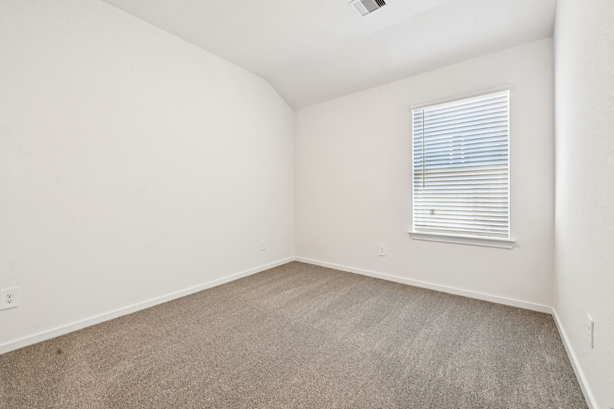 14147 Granger Pointe Lane Conroe, TX 77302 - Photo 23 of 35 an empty room with a window