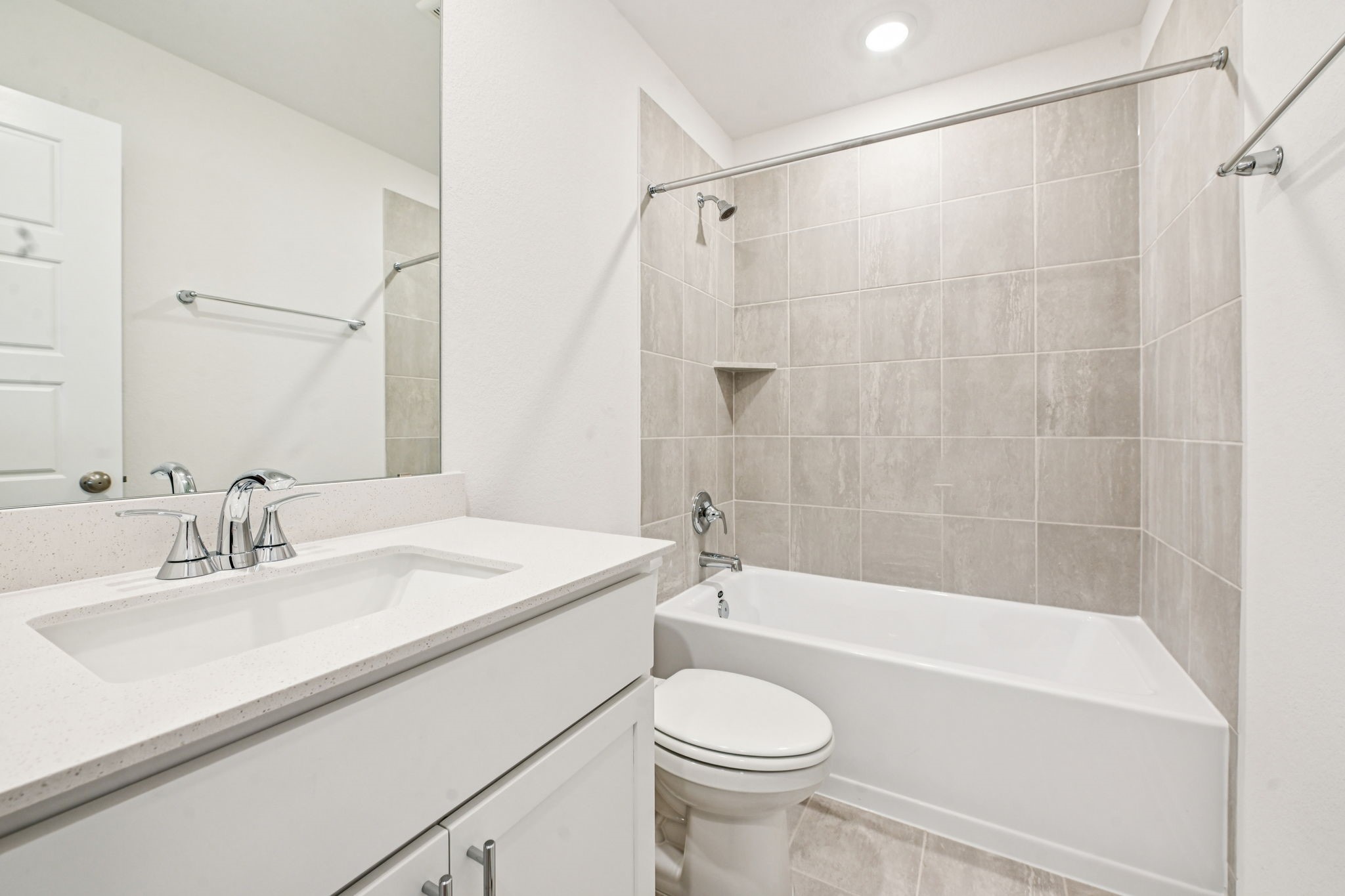 14147 Granger Pointe Lane Conroe, TX 77302 - Photo 26 of 35 a bathroom with a sink a toilet and a bathtub