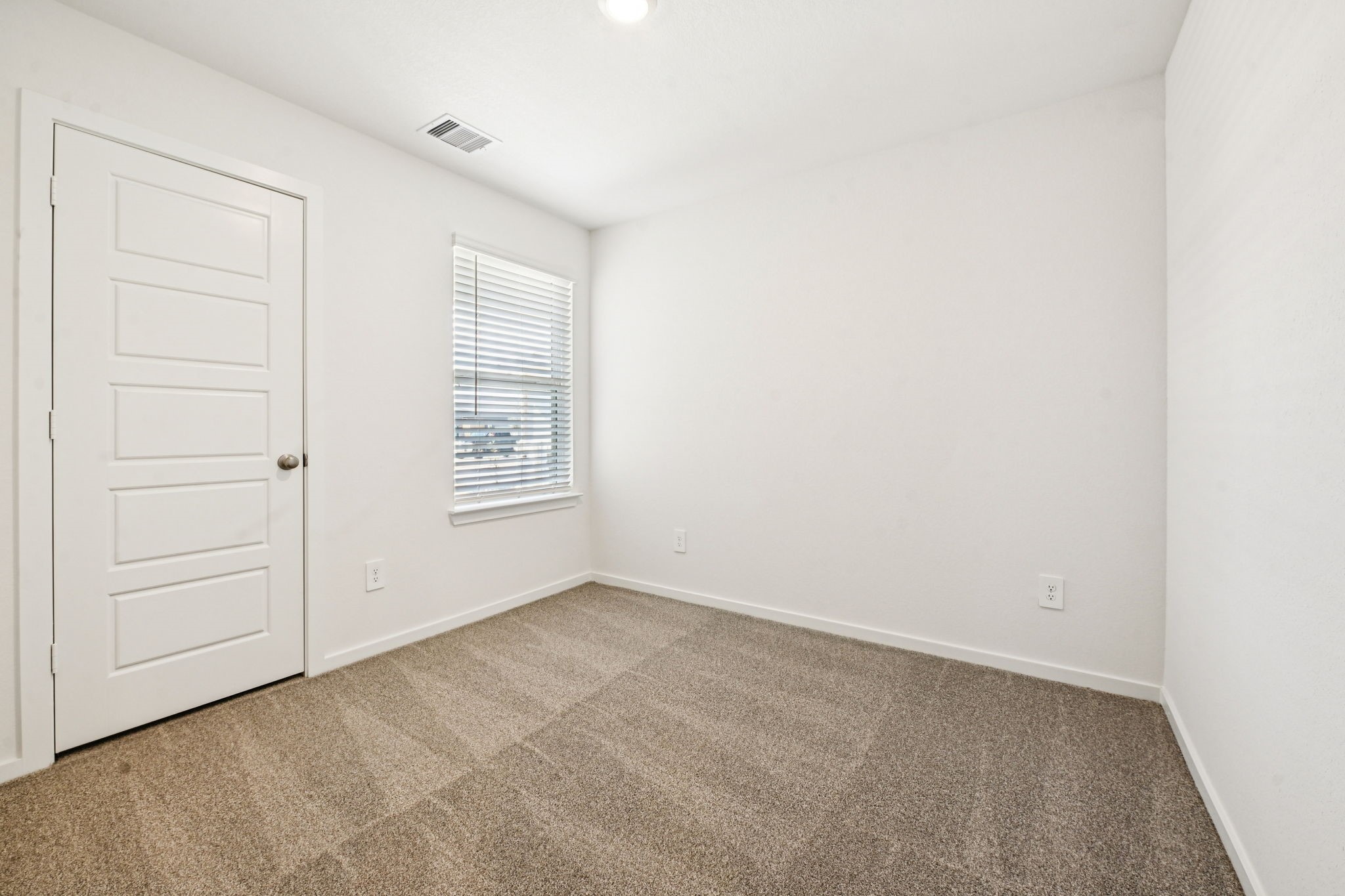 14147 Granger Pointe Lane Conroe, TX 77302 - Photo 27 of 35 a view of an empty room with a window