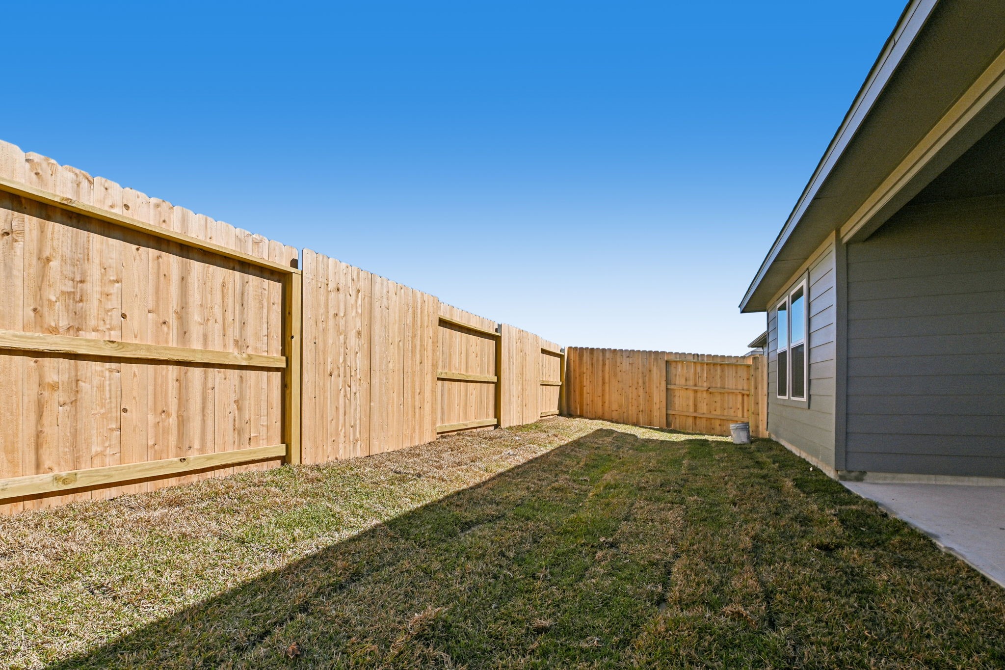 14147 Granger Pointe Lane Conroe, TX 77302 - Photo 33 of 35 a view of an house with backyard and wooden fence