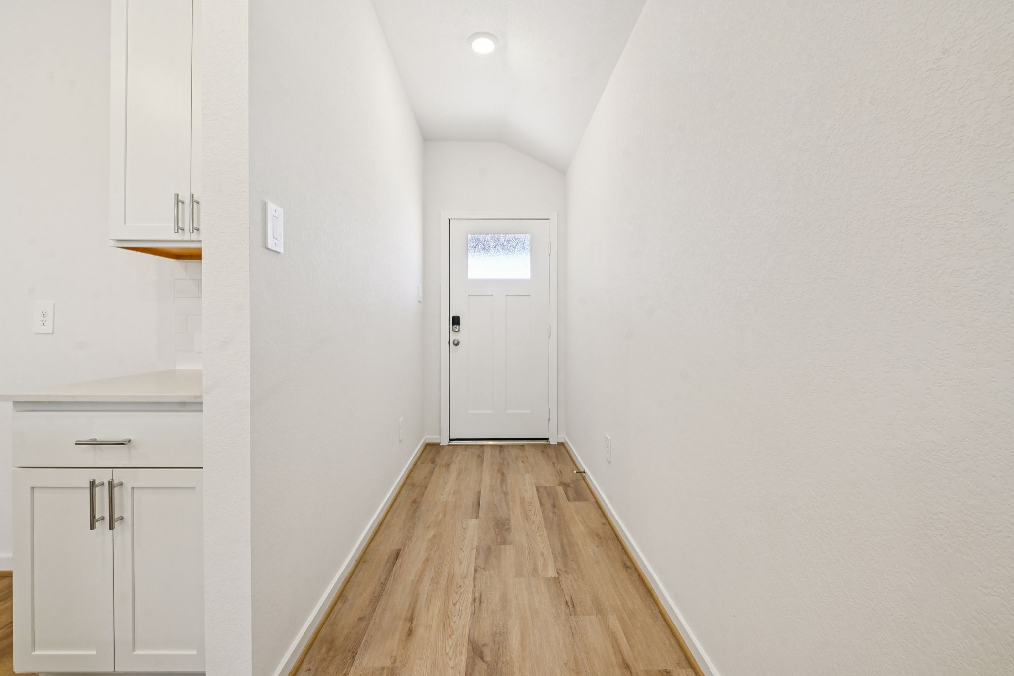 14147 Granger Pointe Lane Conroe, TX 77302 - Photo 5 of 35 a view of a hallway with wooden floor