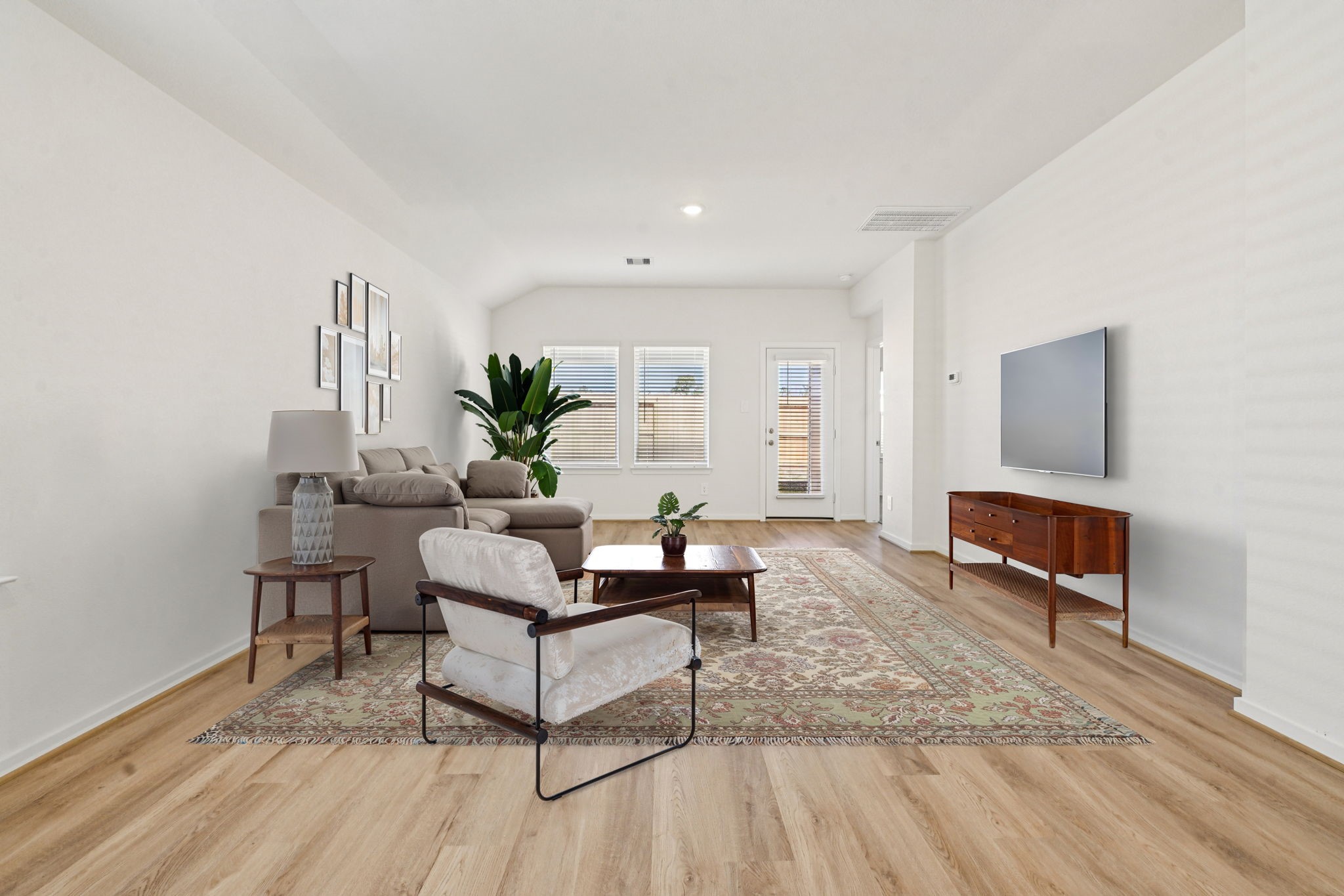 14147 Granger Pointe Lane Conroe, TX 77302 - Photo 7 of 35 a living room with furniture and a wooden floor