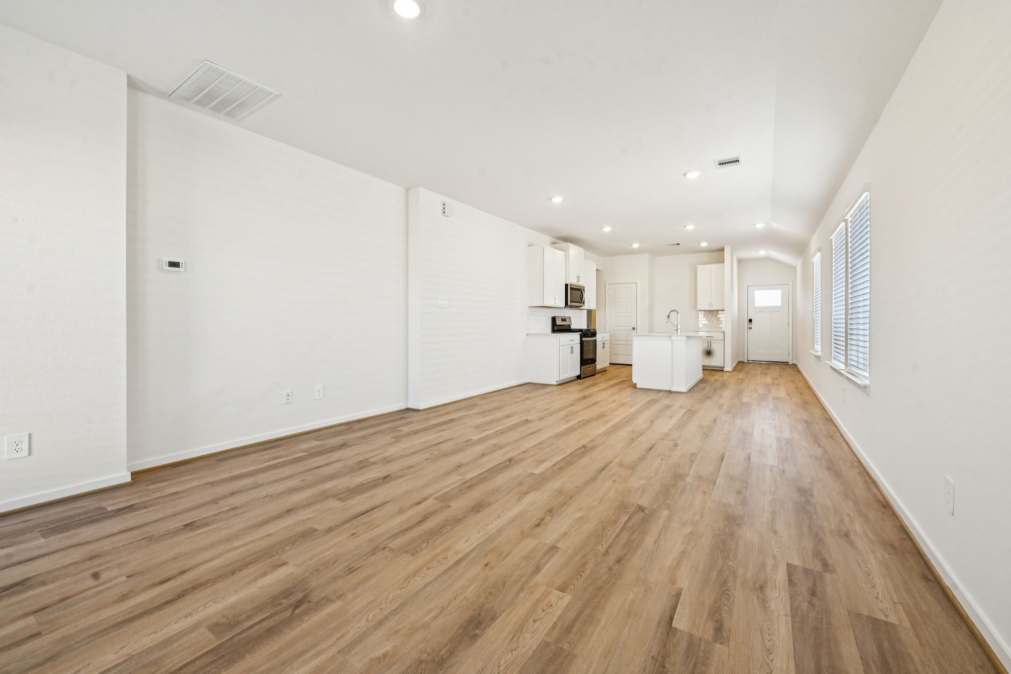 14147 Granger Pointe Lane Conroe, TX 77302 - Photo 8 of 35 a view of empty room with wooden floor