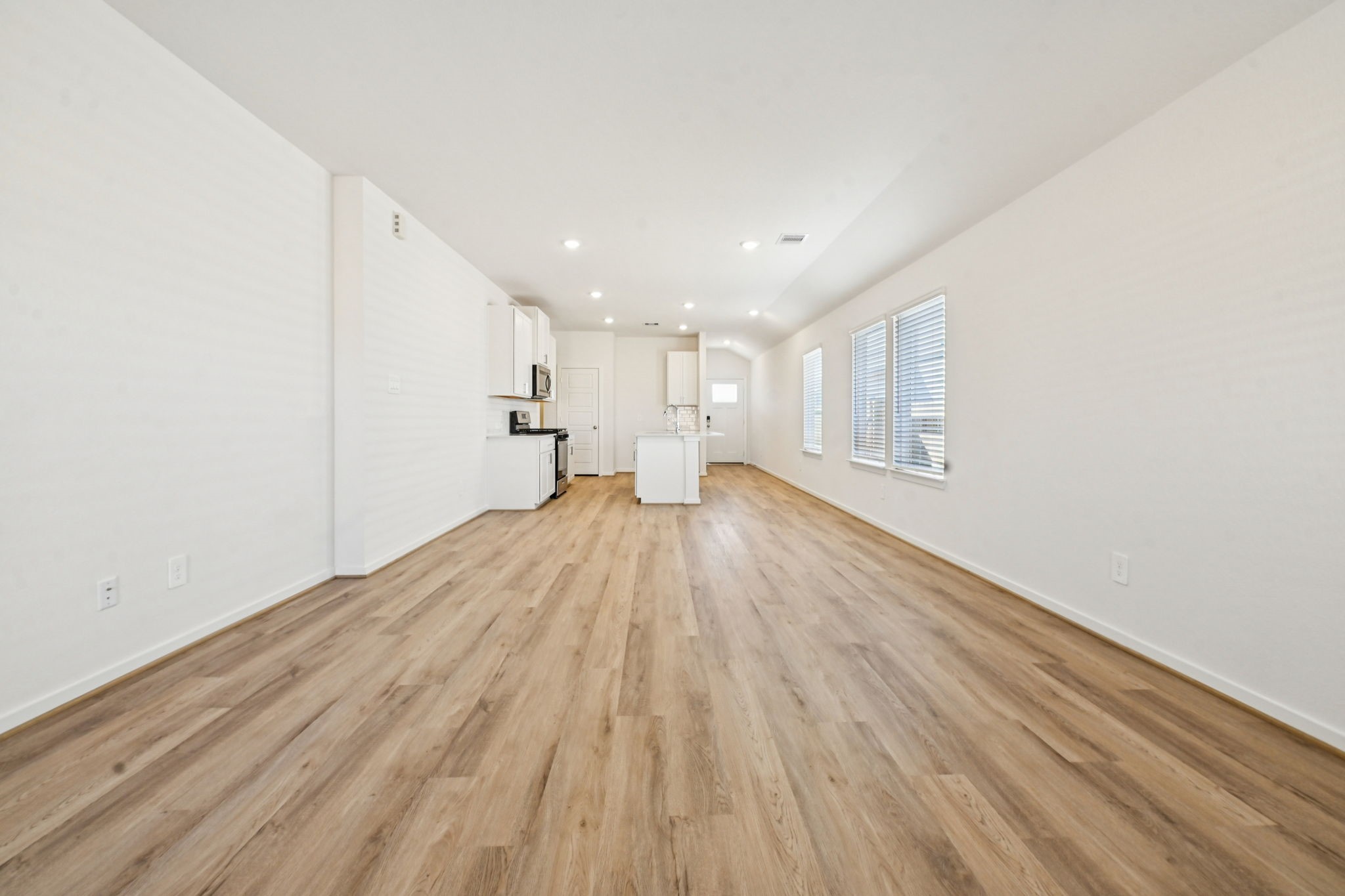 14147 Granger Pointe Lane Conroe, TX 77302 - Photo 10 of 35 a view of empty room with wooden floor