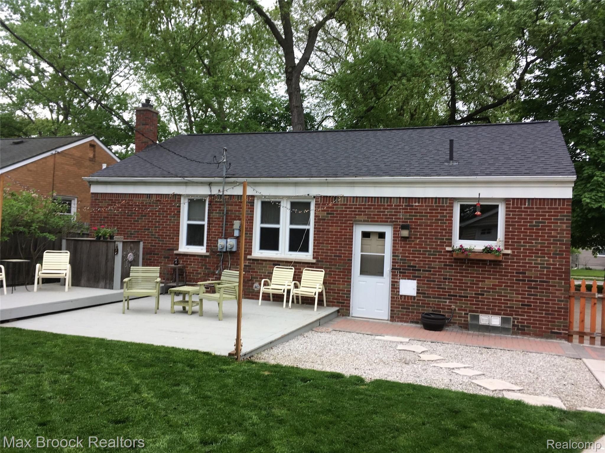 22725 Power Road Farmington, MI 48336 - Photo 3 of 25 Stone patio area as well as two-tiered deck
