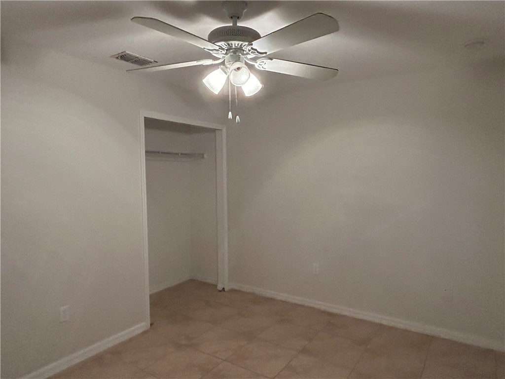 486 Biscayne Lane Sebastian, FL 32958 - Photo 13 of 15 an empty room with a chandelier fan