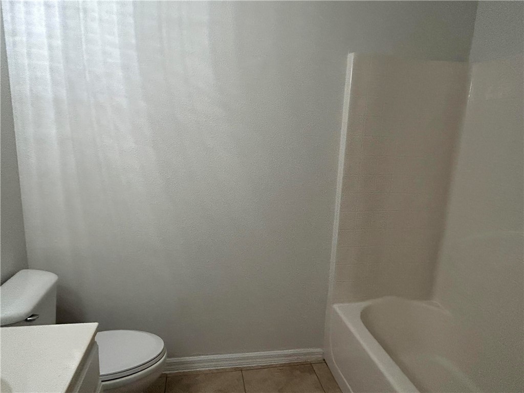 486 Biscayne Lane Sebastian, FL 32958 - Photo 3 of 15 a white toilet sitting next to a white sink