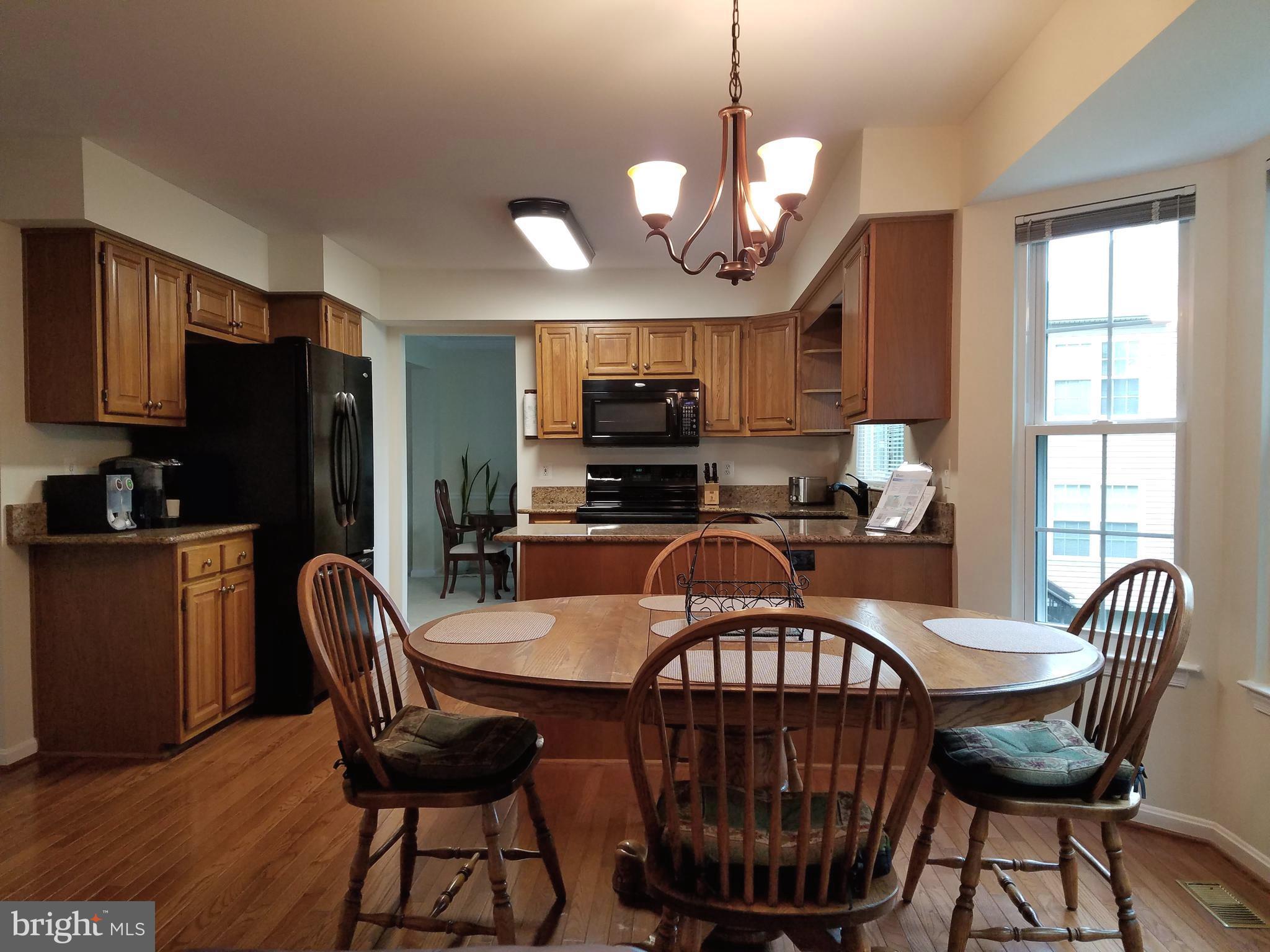 21288 Mirror Ridge Place Sterling, VA 20164 - Photo 6 of 28 Spacious kitchen, bar and dining