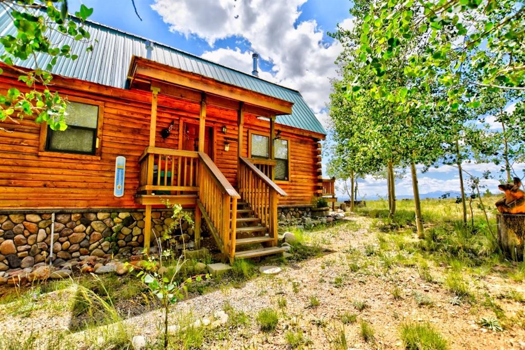 8614 Remington Road Como, CO 80432 - Photo 17 of 35 a backyard of a house with table and chairs