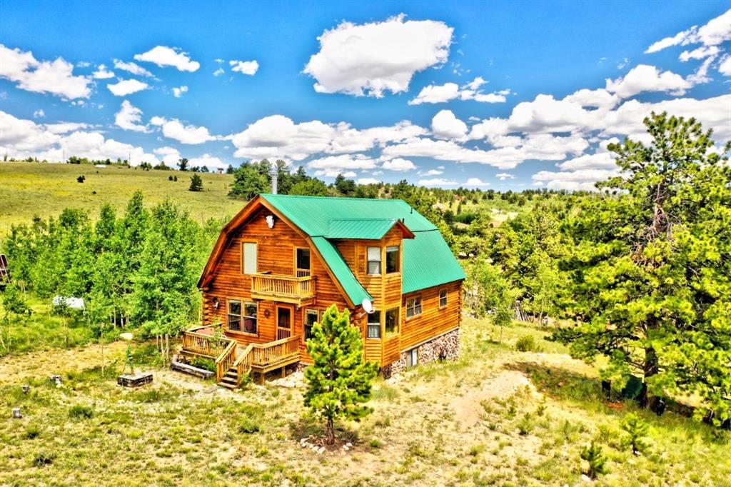 8614 Remington Road Como, CO 80432 - Photo 8 of 35 a aerial view of a house with swimming pool and large trees