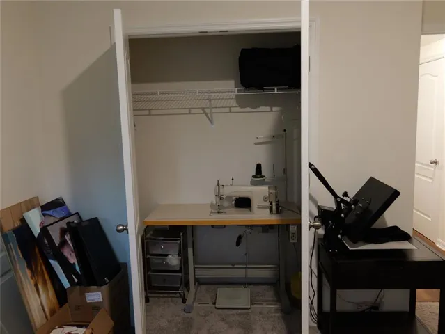 a bedroom with bed and a window