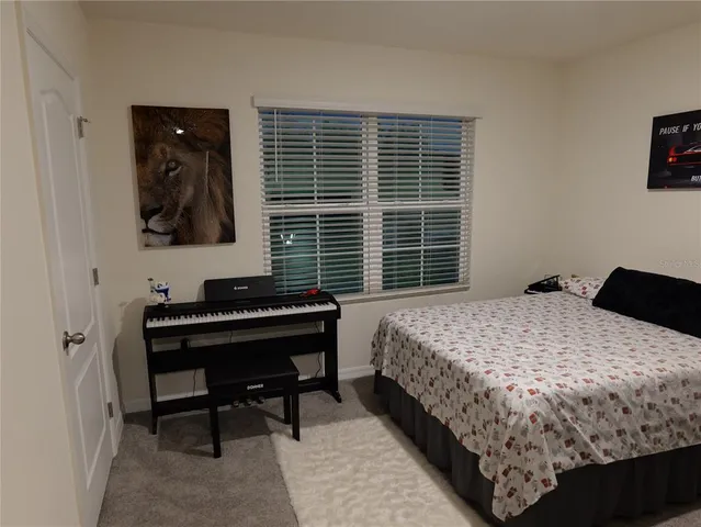a living room with furniture and a walk in closet