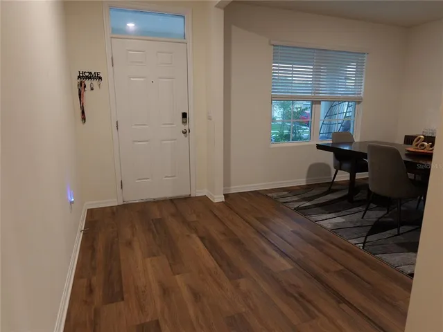 a kitchen with granite countertop stainless steel appliances and a refrigerator