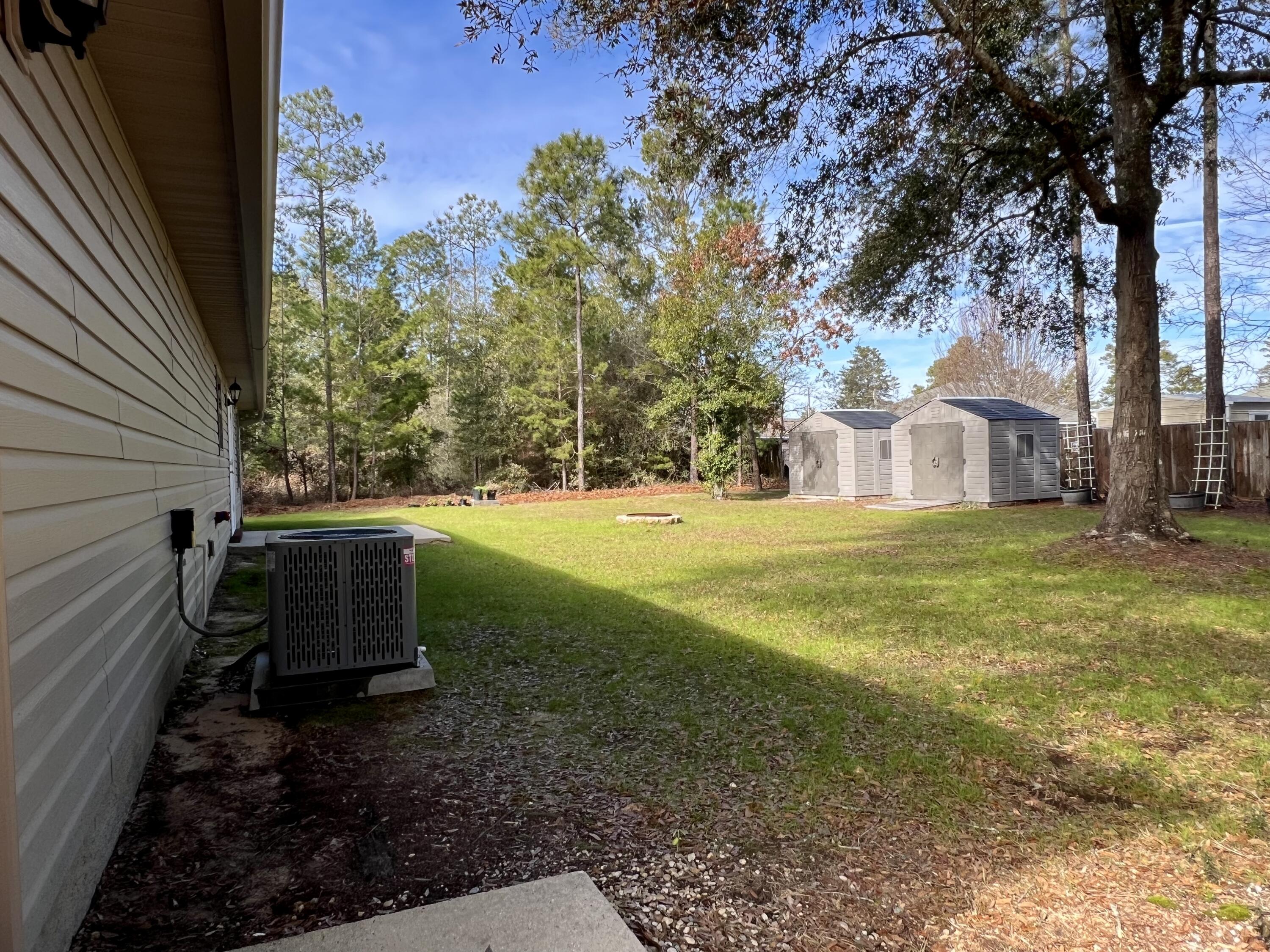 4645 Dove Way Crestview, FL 32539 - Photo 18 of 21 a view of a yard with wooden fence