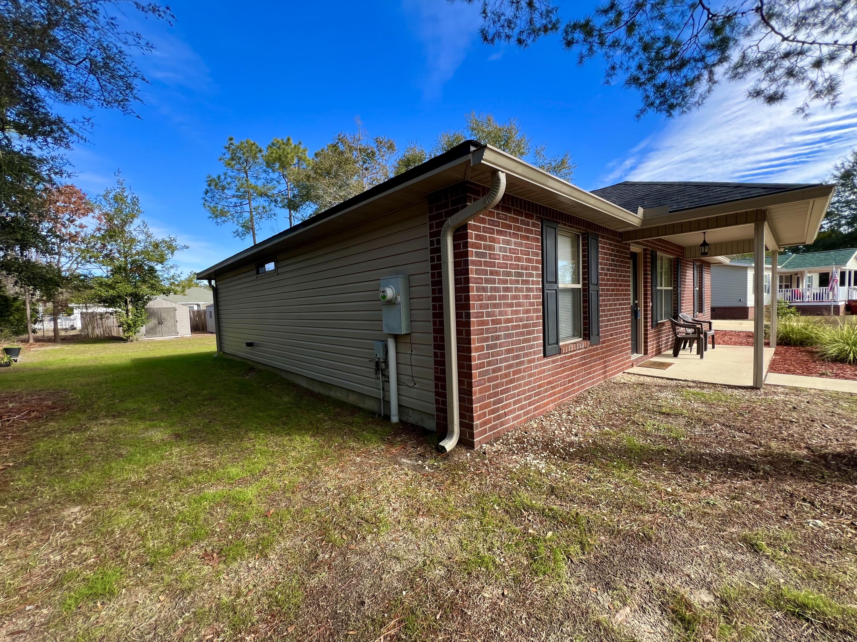 4645 Dove Way Crestview, FL 32539 - Photo 21 of 21 a view of a house with a backyard