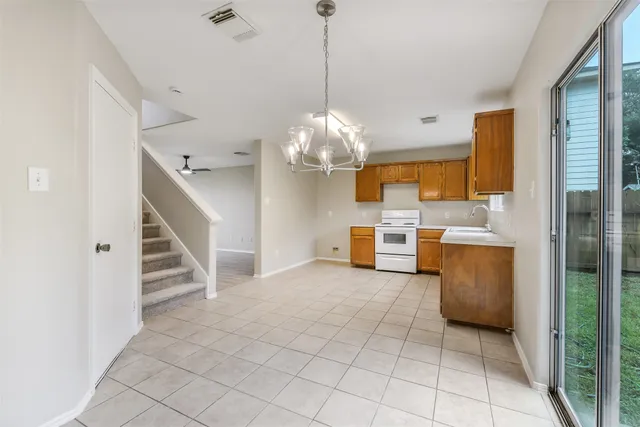 a view of a kitchen with microwave and cabinets