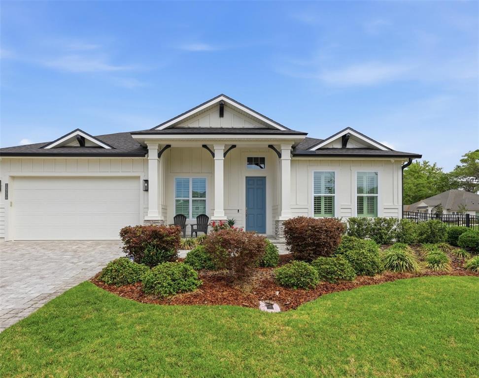 10776 Southwest 36th Place Gainesville, FL 32608 - Photo 1 of 44 a front view of a house with garden
