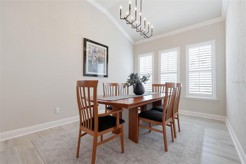 10776 Southwest 36th Place Gainesville, FL 32608 - Photo 14 of 44 a view of a dining room with furniture window and outside view