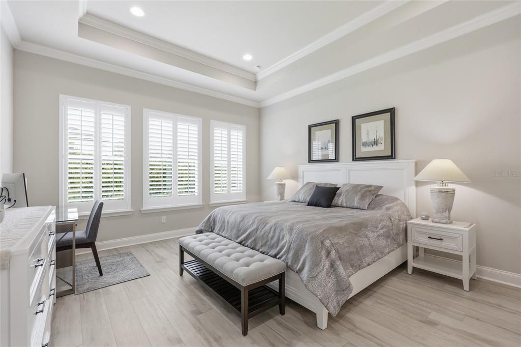 10776 Southwest 36th Place Gainesville, FL 32608 - Photo 16 of 44 a spacious bedroom with a bed and a large window