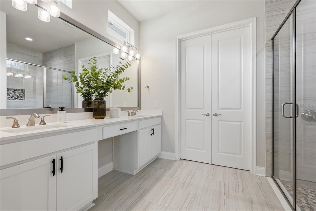10776 Southwest 36th Place Gainesville, FL 32608 - Photo 20 of 44 a bathroom with a sink and a mirror