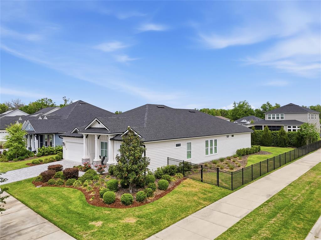 10776 Southwest 36th Place Gainesville, FL 32608 - Photo 2 of 44 a front view of a house with garden