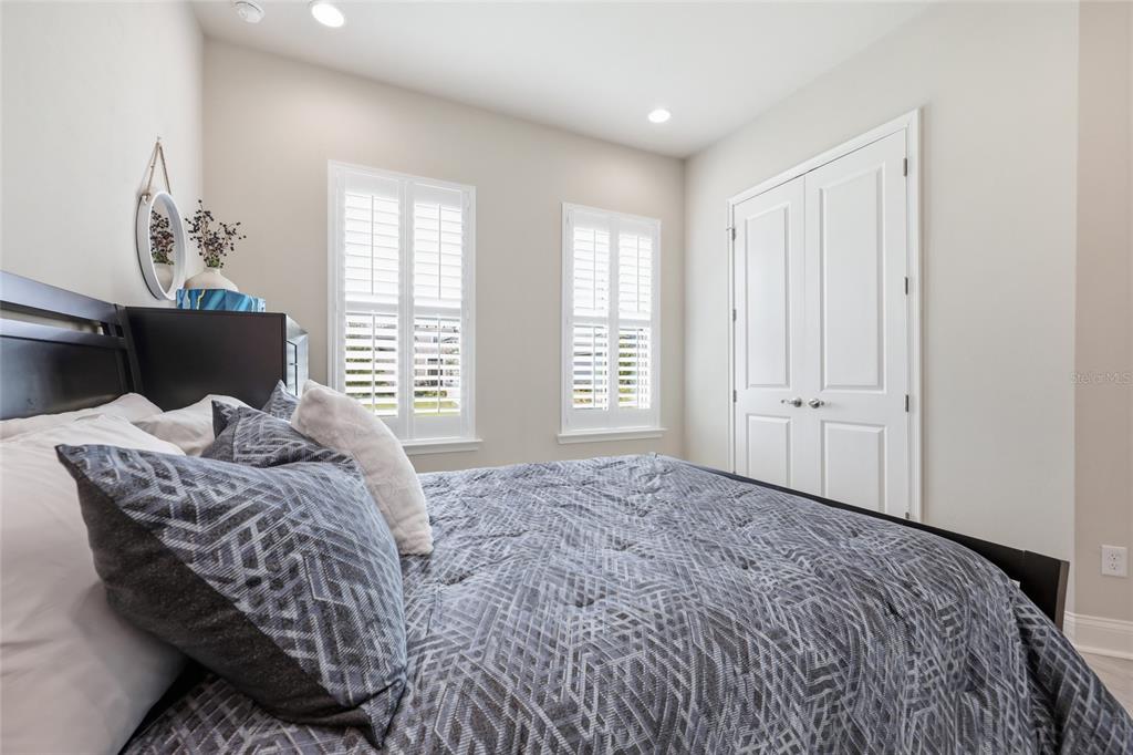 10776 Southwest 36th Place Gainesville, FL 32608 - Photo 24 of 44 a bedroom with a bed and a window